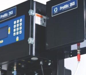A Graco 3KS plural component proportioner is paired with a ProMix 2KS to provide precise mixing of three component materials.