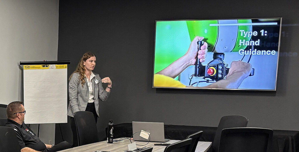 Hope Dollarhide, paint robot sales engineer at First Choice Robotics, presents a seminar on collaborative robotic applications for industrial finishing. Discussion covered cobots or power and force limiting (PFL) robots.